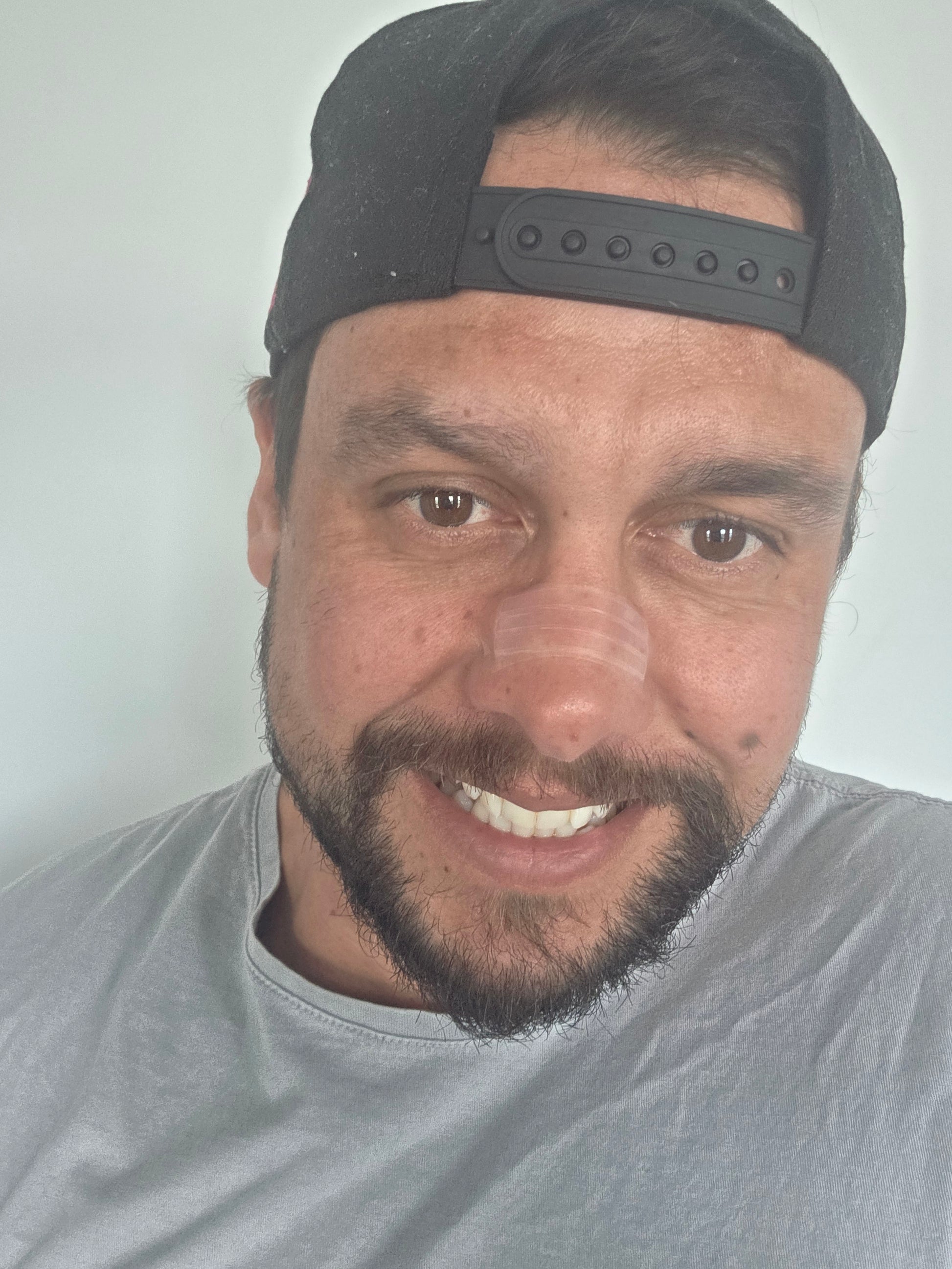 client wearing a nasal strip for better sleep